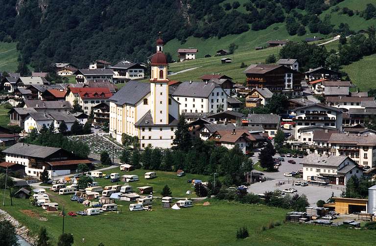 Adjacency of the church and the campground, Neustift